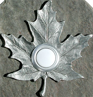 maple leaf doorbell button closeup